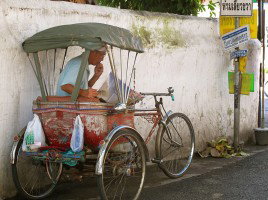 Man on a tuk tuk, Thailand cuisine